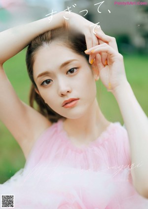A close up of a woman with long brown hair.