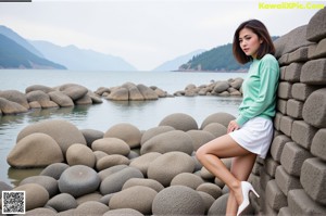 A woman in a red jacket is posing for a picture.